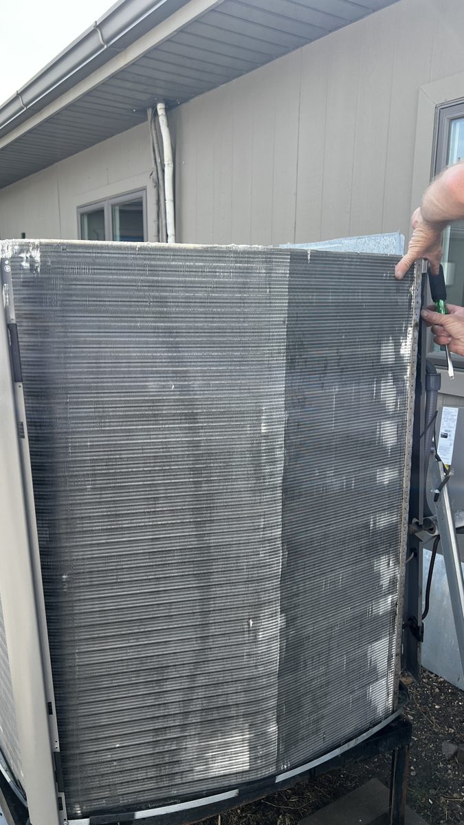 Grove Mechanical technician servicing HVAC equipment
